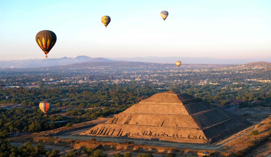 pyramid of the sun and moon with hot air balloons in teotihuacan